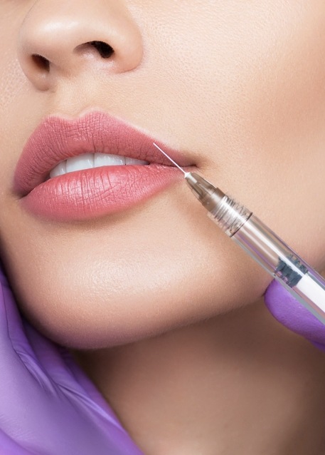 Woman receiving injection in her lip