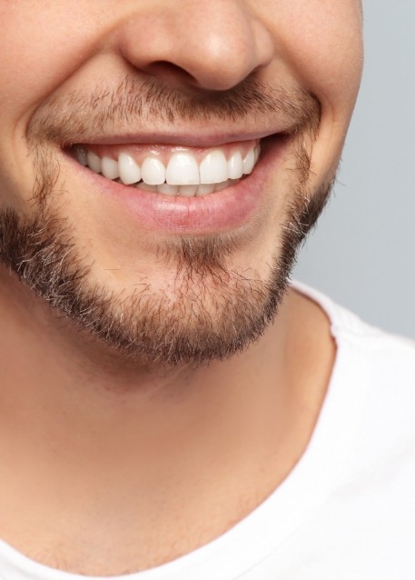 Close up of man with short beard smiling