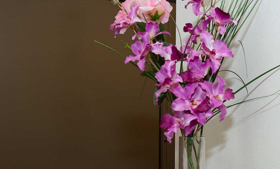 Close up of vase with light purple flowers