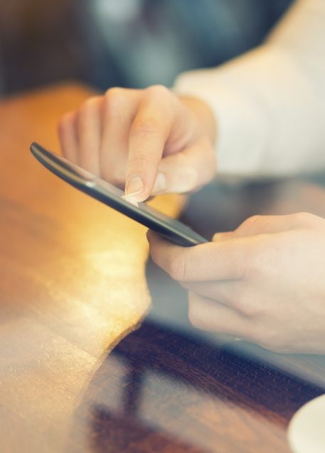 Close up of person scrolling on their phone