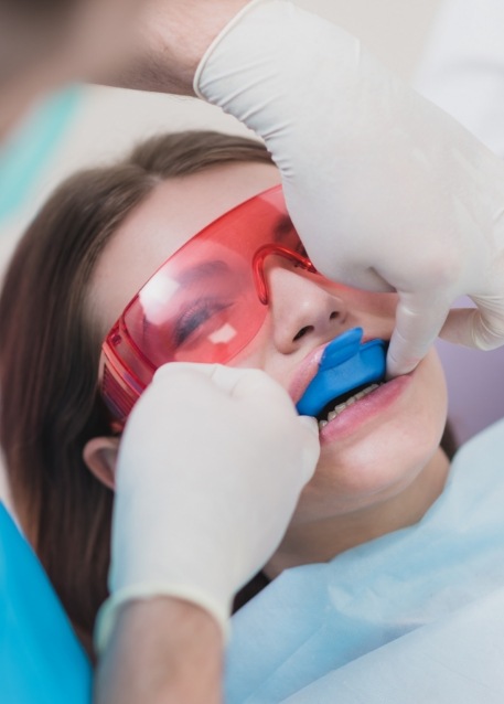 Dental patient having fluoride applied to their teeth