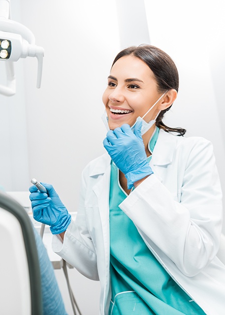 Woman smiling at patient in treatment room