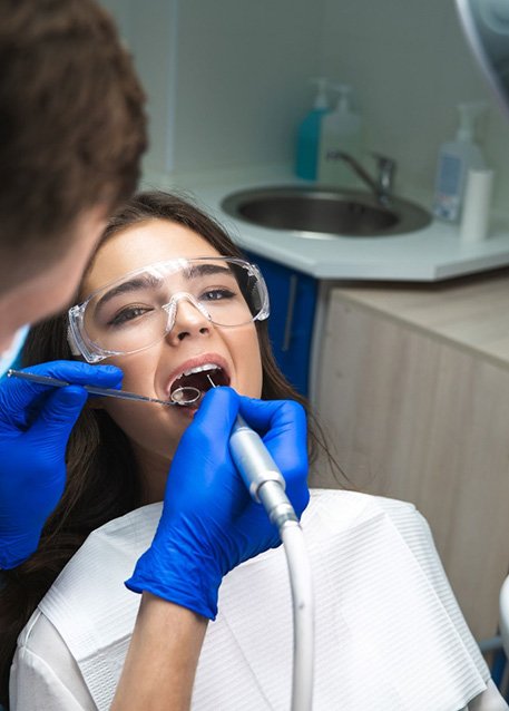 Woman in dental chair undergoing root canal
