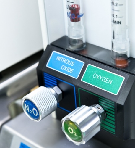 Machine in dental treatment room with buttons for nitrous oxide and oxygen
